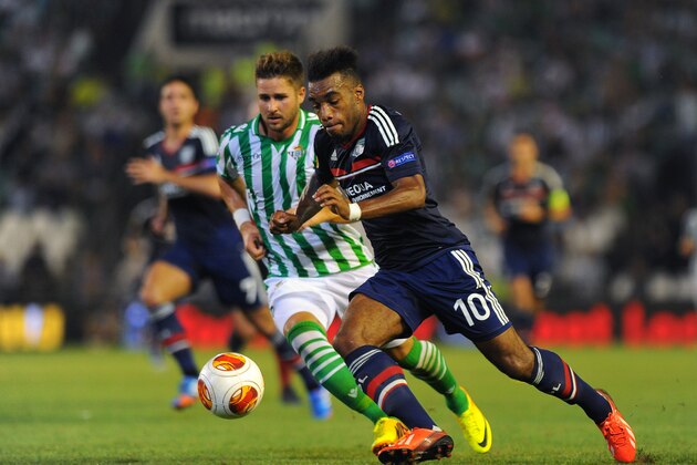 SEVILLE, SPAIN - SEPTEMBER 19:  Alexandre Lacazette (R) of Olympique Lyonnais and Markus Steinhofer of Real Betis Balompie in action during the UEFA Europa League group stage match between Real Betis Balompie and Olympique Lyonnais held on September 19, 2013 at the Benito Villamarin Stadium, in Seville, Spain. (Photo by Jorge Guerrero/EuroFootball/Getty Images)