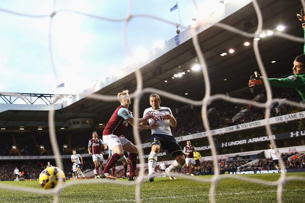 LONDON, ENGLAND - DECEMBER 20: Harry Kane of Tottenham Hotspur scores the opening goal during the Barclays Premier League match between Tottenham Hotspur and Burnley at White Hart Lane on December 20, 2014 in London, England.  (Photo by Clive Rose/Getty Images)