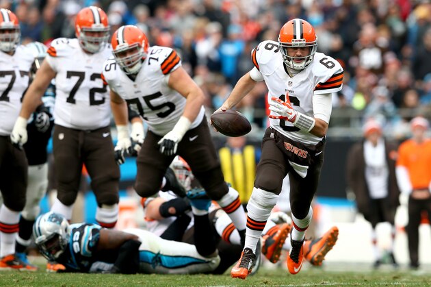 CHARLOTTE, NC - DECEMBER 21:   Brian Hoyer #6 of the Cleveland Browns runs with the ball against the Carolina Panthers during their game at Bank of America Stadium on December 21, 2014 in Charlotte, North Carolina.  (Photo by Streeter Lecka/Getty Images)