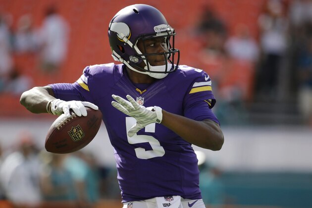 Minnesota Vikings quarterback Teddy Bridgewater (5) warms up before an NFL football game against the Miami Dolphins, Sunday, Dec. 21, 2014, in Miami Gardens, Fla. (AP Photo/Lynne Sladky)