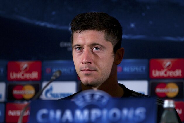 Bayern's Robert Lewandowski listens for a question during the news conference ahead of the Champions League soccer match between CSKA Moscow and Bayern Munich, in Moscow, Russia, Monday, Sept. 29, 2014. (AP Photo/Ivan Sekretarev)