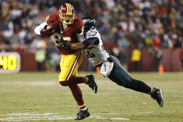 Dec 20, 2014; Landover, MD, USA; Washington Redskins tight end Jordan Reed (86) runs with the ball as Philadelphia Eagles cornerback Brandon Boykin (22) attempts the tackle in the third quarter at FedEx Field. The Redskins won 27-24. Mandatory Credit: Geoff Burke-USA TODAY Sports