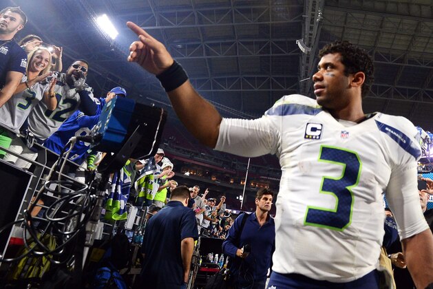 Dec 21, 2014; Glendale, AZ, USA; Seattle Seahawks quarterback Russell Wilson (3) after the second half against the Arizona Cardinals at University of Phoenix Stadium. The Seahawks won 35-6. Mandatory Credit: Joe Camporeale-USA TODAY Sports