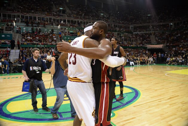 RIO DE JANEIRO, BRAZIL - OCTOBER 11:  LeBron James #23 of the Cleveland Cavaliers and Dwyane Wade #3 of the Miami Heat hug after a game at the HSBC Arena as a part of NBA Global Games on October 11, 2014 in Rio de Janeiro, Brazil.  NOTE TO USER:  User expressly acknowledges and agrees that, by downloading and/or using this photograph, User is consenting to the terms and conditions of the Getty Images License Agreement.  Mandatory Copyright Notice:  Copyright 2014 NBAE (Photo by Andrew D. Bernstein/NBAE via Getty Images)
