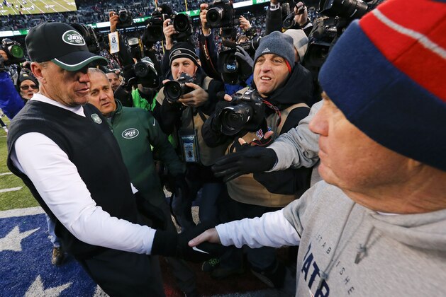 New York Jets head coach Rex Ryan, left, and New England Patriots head coach Bill Belichick, right, shake hands after an NFL football game Sunday, Dec. 21, 2014, in East Rutherford, N.J. The Patriots won the game 17-16. (AP Photo/Julio Cortez)
