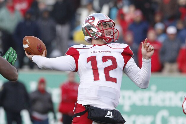 Nov 28, 2014; Huntington, WV, USA; Western Kentucky Hilltoppers quarterback Brandon Doughty (12) passes the ball against the Marshall Thundering Herd at Joan C. Edwards Stadium.   Mandatory Credit: Mark Zerof-USA TODAY Sports