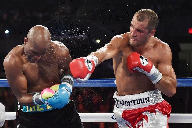 ATLANTIC CITY, NJ - NOVEMBER 08:  Sergey Kovalev punches Bernard Hopkins during their IBF, WBA, & WBO Light Heavyweight title fight at Boardwalk Hall Arena on November 8, 2014 in Atlantic City, New Jersey.  (Photo by Al Bello/Getty Images)