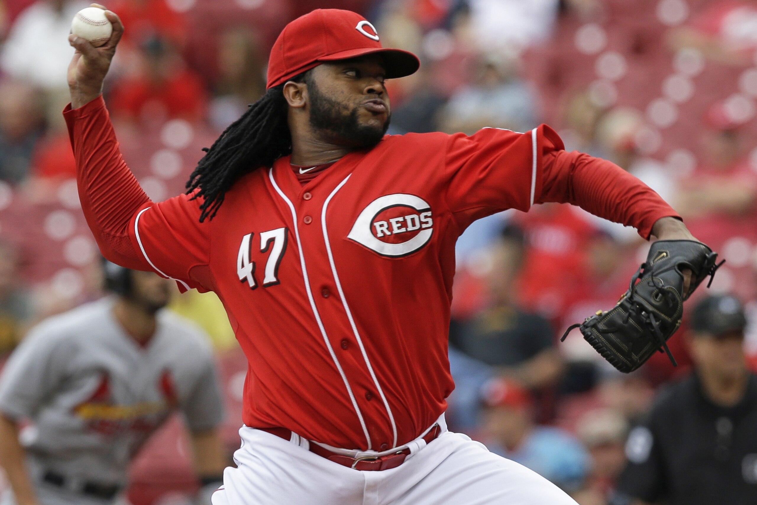 Cincinnati Reds starting pitcher Johnny Cueto (47) throws against the St. Louis Cardinals in the first inning of a baseball game, Thursday, Sept. 11, 2014, in Cincinnati. (AP Photo/Al Behrman)