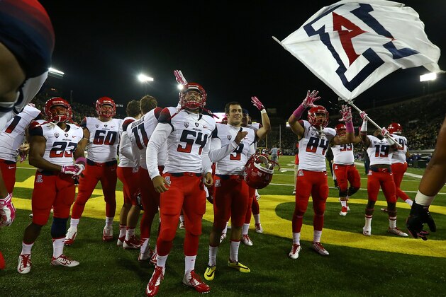 EUGENE, OR - OCTOBER 02:  The Arizona Wildcats celebrate their 31-24 victory over the Oregon Ducks at Autzen Stadium on October 2, 2014  in Eugene, Oregon.  (Photo by Jonathan Ferrey/Getty Images)