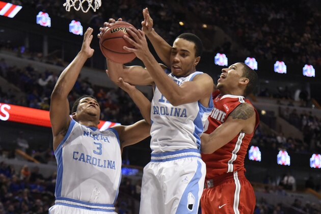 CHICAGO, IL- DECEMBER 20: Brice Johnson #11 of the North Carolina Tar Heels grabs a rebound in front of Marc Loving #2 of the Ohio State Buckeyesduring the second half of the CBS Sports Classic on December 20, 2014 at the United Center in Chicago, Illinois. The North Carolina Tar Heels defeated the Ohio State Buckeyes 82-74. (Photo by David Banks/Getty Images)