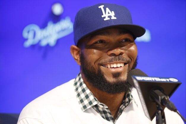 Los Angeles Dodgers baseball player Howie Kendrick takes questions from the media at an introductory news conference at Dodger Stadium in Los Angeles Friday, Dec. 19, 2014. (AP Photo/Damian Dovarganes)