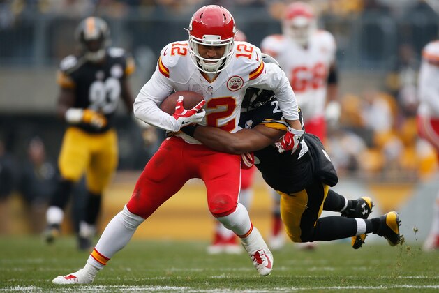 PITTSBURGH, PA - DECEMBER 21:  Albert Wilson #12 of the Kansas City Chiefs gets wrapped up by Mike Mitchell #23 of the Pittsburgh Steelers during the second quarter at Heinz Field on December 21, 2014 in Pittsburgh, Pennsylvania.  (Photo by Gregory Shamus/Getty Images)