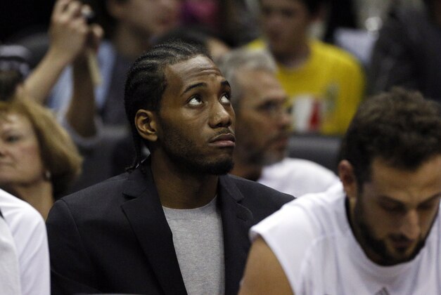 Dec 10, 2014; San Antonio, TX, USA; San Antonio Spurs small forward Kawhi Leonard (2) watches from the bench against the New York Knicks during the second half at AT&T Center. Mandatory Credit: Soobum Im-USA TODAY Sports