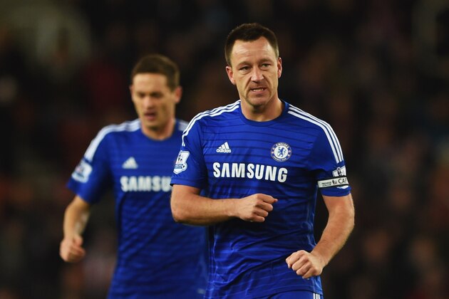 STOKE ON TRENT, ENGLAND - DECEMBER 22:  John Terry of Chelsea (R) celebrates as he scores their first goal during the Barclays Premier League match between Stoke City and Chelsea at Britannia Stadium on December 22, 2014 in Stoke on Trent, England.  (Photo by Michael Regan/Getty Images)