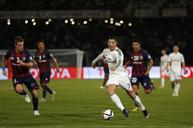 MARRAKECH, MOROCCO - DECEMBER 20: Cristiano Ronaldo of Real Madrid CF breaks away from the San Lorenzo defence during the FIFA Club World Cup Final match between Real Madrid CF and San Lorenzo at Le Grand Stade de Marrakech on December 20, 2014 in Marrakech, Morocco.  (Photo by Steve Bardens/Getty Images)