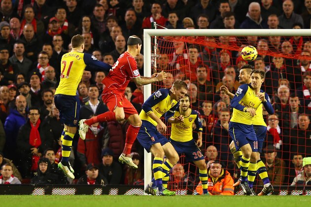 LIVERPOOL, ENGLAND - DECEMBER 21:  Martin Skrtel of Liverpool heads the equalising goal during the Barclays Premier League match between Liverpool and Arsenal at Anfield on December 21, 2014 in Liverpool, England.  (Photo by Alex Livesey/Getty Images)