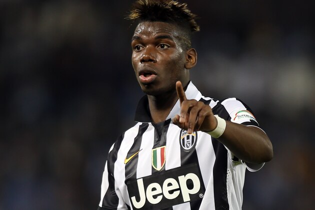 Juventus midfielder Paul Pogba gestures during the Italian Super Cup final match Napoli against Juventus in Doha, Qatar, Monday Dec. 22, 2014. (AP Photo/Osama Faisal)