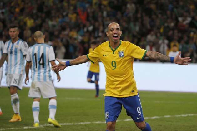 Brazil's Diego Tardelli celebrates after he scored his team's second goal during a Brazil vs. Argentina friendly match at the Bird's Nest National Stadium in Beijing, China, Saturday, Oct. 11, 2014. (AP Photo/Ng Han Guan)