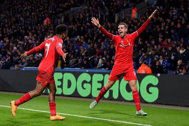 LEICESTER, ENGLAND - DECEMBER 02:  Jordan Henderson (R) of Liverpool celebrates with teammate Raheem Sterling of Liverpool after scoring his team's third goal during the Barclays Premier League match between Leicester City and Liverpool at The King Power Stadium on December 2, 2014 in Leicester, England.  (Photo by Shaun Botterill/Getty Images)