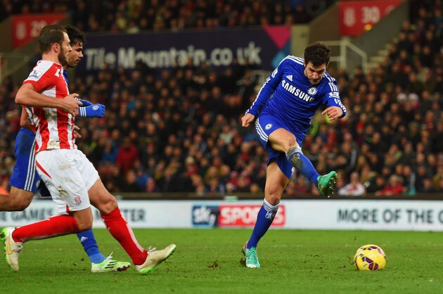 STOKE ON TRENT, ENGLAND - DECEMBER 22:  Cesc Fabregas of Chelsea scores their second goal during the Barclays Premier League match between Stoke City and Chelsea at Britannia Stadium on December 22, 2014 in Stoke on Trent, England.  (Photo by Michael Regan/Getty Images)