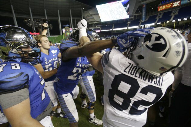 Players scuffle after Memphis defeated Brigham Young, 55-48 in double overtime during the inaugural Miami Beach Bowl football game, Monday, Dec. 22, 2014 in Miami. (AP Photo/Wilfredo Lee)
