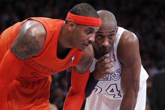 New York Knicks forward Carmelo Anthony, left, waits with Los Angeles Lakers guard Kobe Bryant for a foul shot during the first half of their NBA basketball game in Los Angeles, Tuesday, Dec. 25, 2012.  (AP Photo/Alex Gallardo)