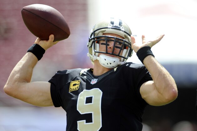 New Orleans Saints quarterback Drew Brees (9) warms up before the start of an NFL football game against the Tampa Bay Buccaneers Sunday, Sept. 15, 2013, in Tampa, Fla. (AP Photo/Brian Blanco