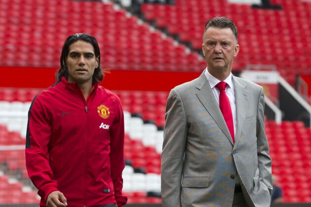 Manchester United's new player Radamel Falcao, left, walks across the pitch with manager Louis van Gaal at Old Trafford Stadium, Manchester, England, Thursday Sept. 11, 2014. The Colombian striker Falcao joined on a season-long loan deal from Ligue 1 side Monaco as Louis van Gaal looks to bolster his attacking options. (AP Photo/Jon Super) Manchester United's new player Radamel Falcao, left, walks across the pitch with manager Louis van Gaal at Old Trafford Stadium, Manchester, England, Thursday Sept. 11, 2014. The Colombian striker Falcao joined on a season-long loan deal from Ligue 1 side Monaco as Louis van Gaal looks to bolster his attacking options. (AP Photo/Jon Super)