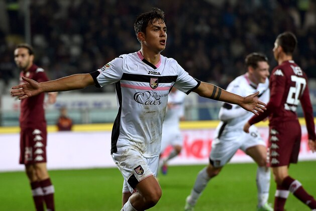 TURIN, ITALY - DECEMBER 06:  Paulo Dybala of Palermo celebrates after scoring his team's second goal during the Serie A match between Torino FC and US Citta di Palermo at Stadio Olimpico di Torino on December 6, 2014 in Turin, Italy.  (Photo by Tullio M. Puglia/Getty Images)