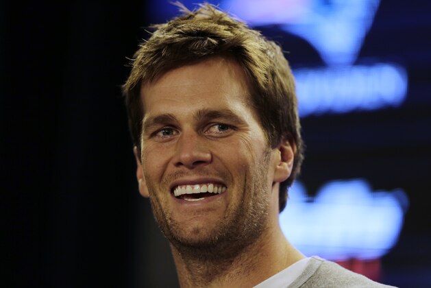 New England Patriots quarterback Tom Brady answers a question during a news conference prior to an NFL football practice in Foxborough, Mass., Wednesday, Dec. 17, 2014. (AP Photo/Charles Krupa)