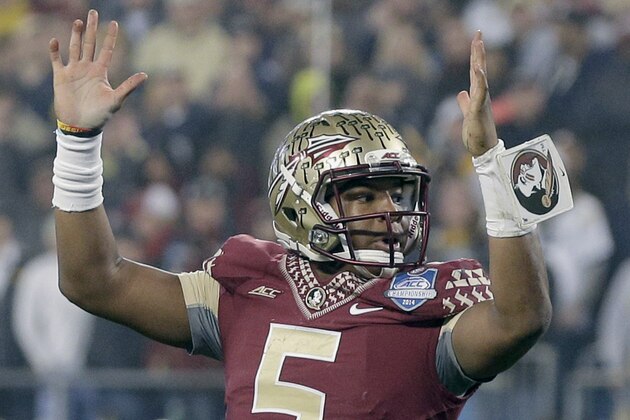 Florida State quarterback Jameis Winston (5) raises his arms after a touchdown against Georgia Tech during the first half of the Atlantic Coast Conference championship NCAA college football game in Charlotte, N.C., Saturday, Dec. 6, 2014. (AP Photo/Chuck Burton)