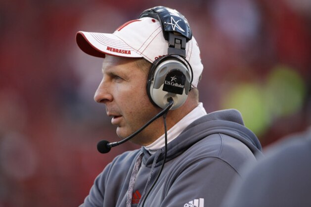 Nebraska head coach Bo Pelini follows his players in the second half of an NCAA college football game against Purdue in Lincoln, Neb., Saturday, Nov. 1, 2014. Nebraska won 45-14. (AP Photo/Nati Harnik)