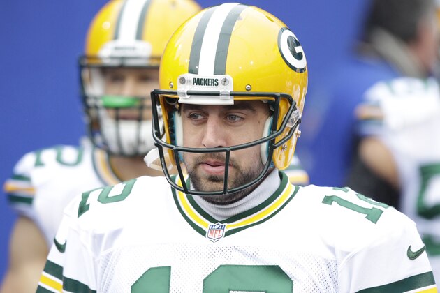 Green Bay Packers quarterback Aaron Rodgers (12) leads teammates toward the field at Ralph Wilson Stadium to warm up before an NFL football game against the Buffalo Bills Sunday, Dec. 14, 2014, in Orchard Park, N.Y.  (AP Photo/Bill Wippert)
