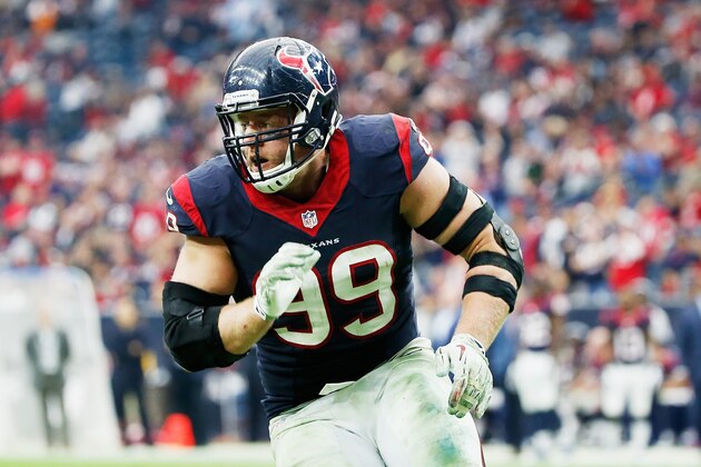 HOUSTON, TX - DECEMBER 21:  J.J. Watt #99 of the Houston Texans rushes the passer during their game against the Baltimore Ravens at NRG Stadium on December 21, 2014 in Houston, Texas.  (Photo by Scott Halleran/Getty Images)