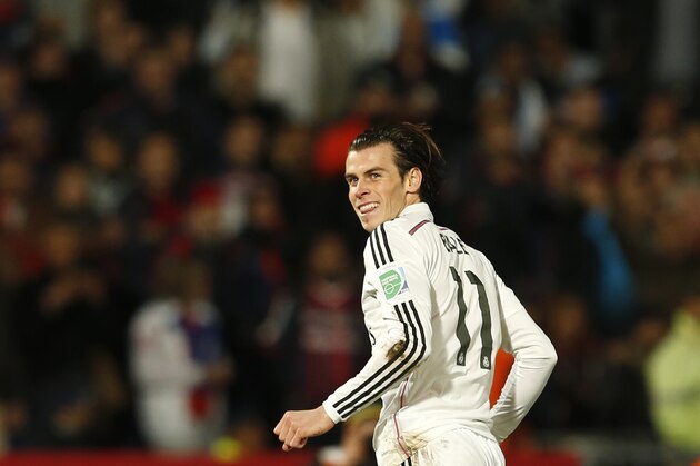 Real Madrid’s Gareth Bale runs after scoring during the final match against San Lorenzo  for the Club World Cup soccer tournament, in Marrakech, Morocco, Saturday, Dec. 20, 2014. (AP Photo/Abdeljalil Bounhar)