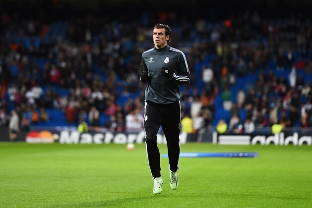 MADRID, SPAIN - NOVEMBER 04:  Gareth Bale of Real Madrid CF warms up prior to  the UEFA Champions League Group B match between Real Madrid CF and Liverpool FC at Estadio Santiago Bernabeu on November 4, 2014 in Madrid, Spain.  (Photo by Shaun Botterill/Getty Images)