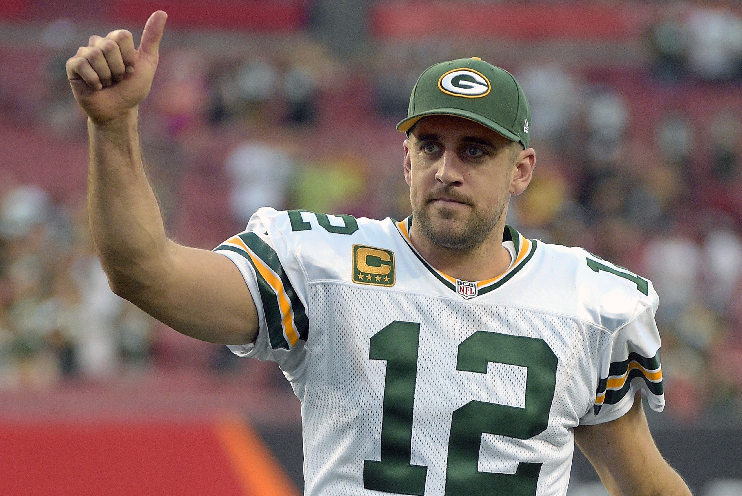 Green Bay Packers quarterback Aaron Rodgers (12) gives the thumbs up to fans as he leaves the field following the team's 20-3 win over the Tampa Bay Buccaneers during an NFL football game Sunday, Dec. 21, 2014, in Tampa, Fla. (AP Photo/Phelan M. Ebenhack)