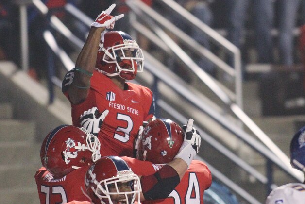 Fresno State's Josh Harper, top, celebrates a touchdown catch against San Jose State in the first half of an NCAA college football game in Fresno, Calif., Saturday, Nov. 8, 2014. (AP Photo/Gary Kazanjian)