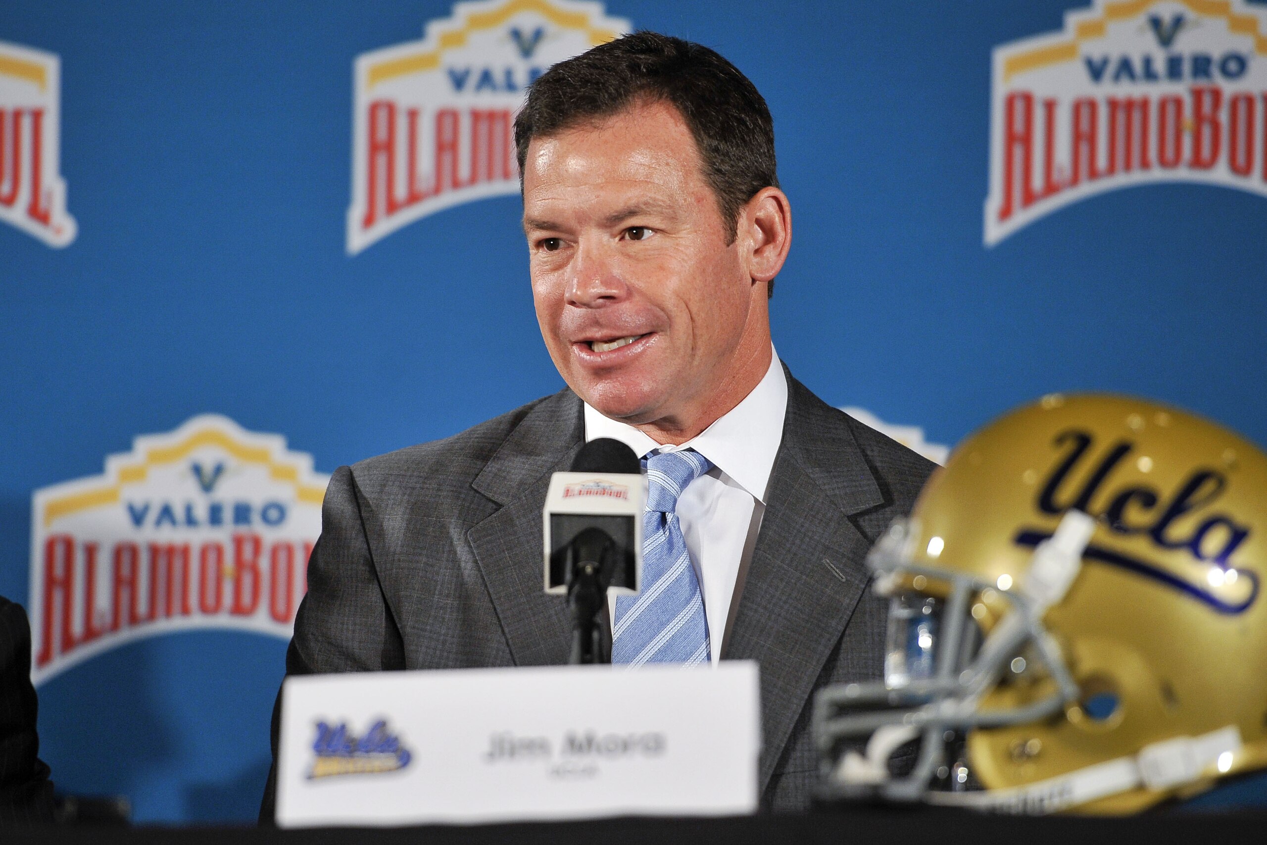 UCLA coach Jim Mora speaks during a press conference held to introduce the 2015 Valero Alamo Bowl college football head coaches, Thursday, Dec. 11, 2014, in San Antonio. UCLA will play Kansas State. (AP Photo/Darren Abate)