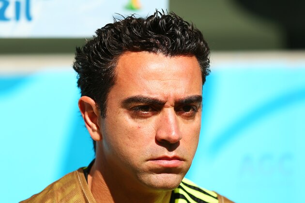 CURITIBA, BRAZIL - JUNE 23:  Xavi Hernandez of Spain looks on from the bench during the 2014 FIFA World Cup Brazil Group B match between Australia and Spain at Arena da Baixada on June 23, 2014 in Curitiba, Brazil.  (Photo by Cameron Spencer/Getty Images)