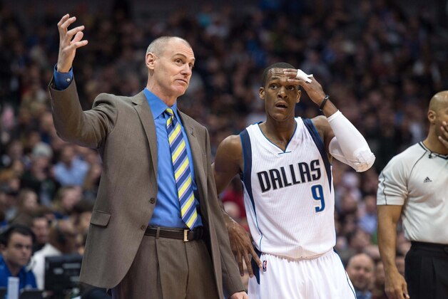 Dec 20, 2014; Dallas, TX, USA; Dallas Mavericks head coach Rick Carlisle gives instructions to guard Rajon Rondo (9) during the second half against the San Antonio Spurs at the American Airlines Center. The Mavericks defeated the Spurs 99-93. Mandatory Credit: Jerome Miron-USA TODAY Sports