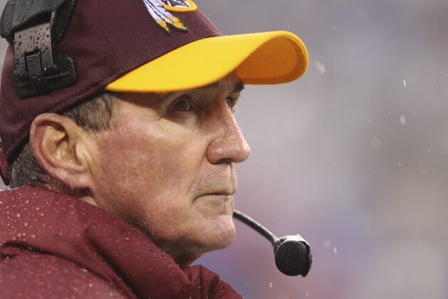 Washington Redskins head coach Mike Shanahan watches his team during the first half of an NFL football game against the New York Giants Sunday, Dec. 29, 2013, in East Rutherford, N.J.  (AP Photo/Peter Morgan)