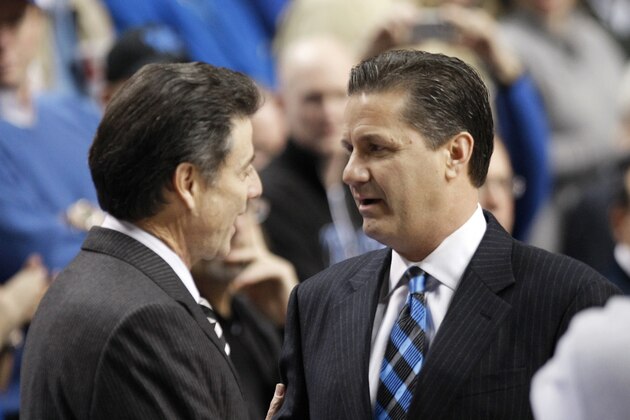 Louisville coach Rick Pitino, left, and Kentucky coach John Calipari meet prior to their NCAA college basketball game in Lexington, Ky., Saturday, Jan. 2, 2010. Kentucky won the game 71-62.  (AP Photo/Ed Reinke)