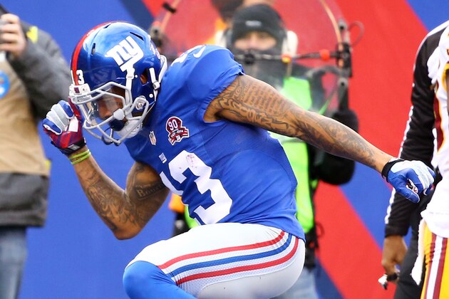 EAST RUTHERFORD, NJ - DECEMBER 14:  Odell Beckham Jr. #13 of the New York Giants celebrates after scoring 10 yard touchdown thrown by Eli Manning #10 in the first quarter against the Washington Redskins during their game at MetLife Stadium on December 14, 2014 in East Rutherford, New Jersey.  (Photo by Al Bello/Getty Images)