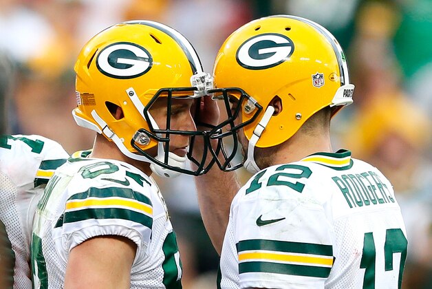 TAMPA, FL - DECEMBER 21:  Aaron Rodgers #12 of the Green Bay Packers reacts with Jordy Nelson #87 after they connected for a touchdown against the Tampa Bay Buccaneers at Raymond James Stadium on December 21, 2014 in Tampa, Florida.  (Photo by Kevin C. Cox/Getty Images)