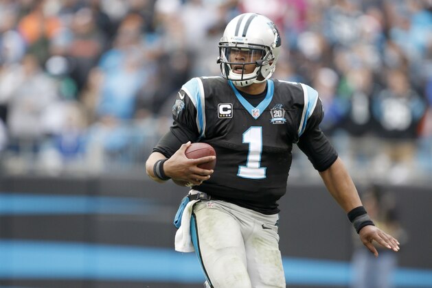 Carolina Panthers' Cam Newton (1) scrambles against the Cleveland Browns during the second half of an NFL football game in Charlotte, N.C., Sunday, Dec. 21, 2014. The Panthers won 17-13. (AP Photo/Bob Leverone)
