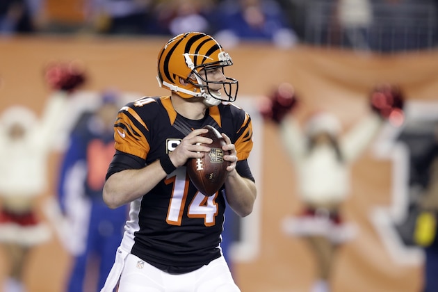 Cincinnati Bengals quarterback Andy Dalton looks to pass against the Denver Broncos during the first half of an NFL football game Monday, Dec. 22, 2014, in Cincinnati. (AP Photo/Darron Cummings)
