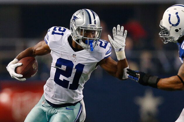 ARLINGTON, TX - DECEMBER 21:  Joseph Randle #21 of the Dallas Cowboys carries the ball as Jerrell Freeman #50 of the Indianapolis Colts tries to position for the tackle in the first half at AT&T Stadium on December 21, 2014 in Arlington, Texas.  (Photo by Tom Pennington/Getty Images)