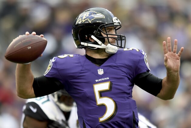 Baltimore Ravens quarterback Joe Flacco (5) passes the ball during the first half of an NFL football game against the Jacksonville Jaguars in Baltimore, Sunday, Dec. 14, 2014. (AP Photo/Gail Burton)