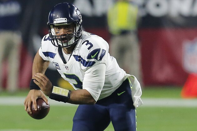 Seattle Seahawks quarterback Russell Wilson (3) during the first quarter of an NFL football game against the Arizona Cardinals, Sunday, Dec. 21, 2014 in Glendale, Ariz. (AP Photo/Rick Scuteri)